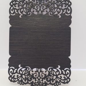 "An intricately designed wooden wedding invitation with elegant laser-cut details. The rich dark wood showcases delicate patterns and ornate edges, setting the tone for a sophisticated and memorable wedding celebration."
