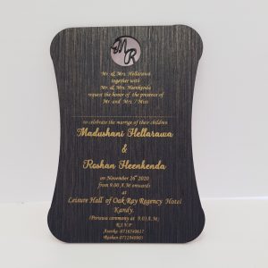 "Budget-friendly dark wood wooden invitation adorned with custom letters. This economical invitation option showcases personalized lettering on a rich, dark wood background, offering a simple yet charming way to invite guests to your event."